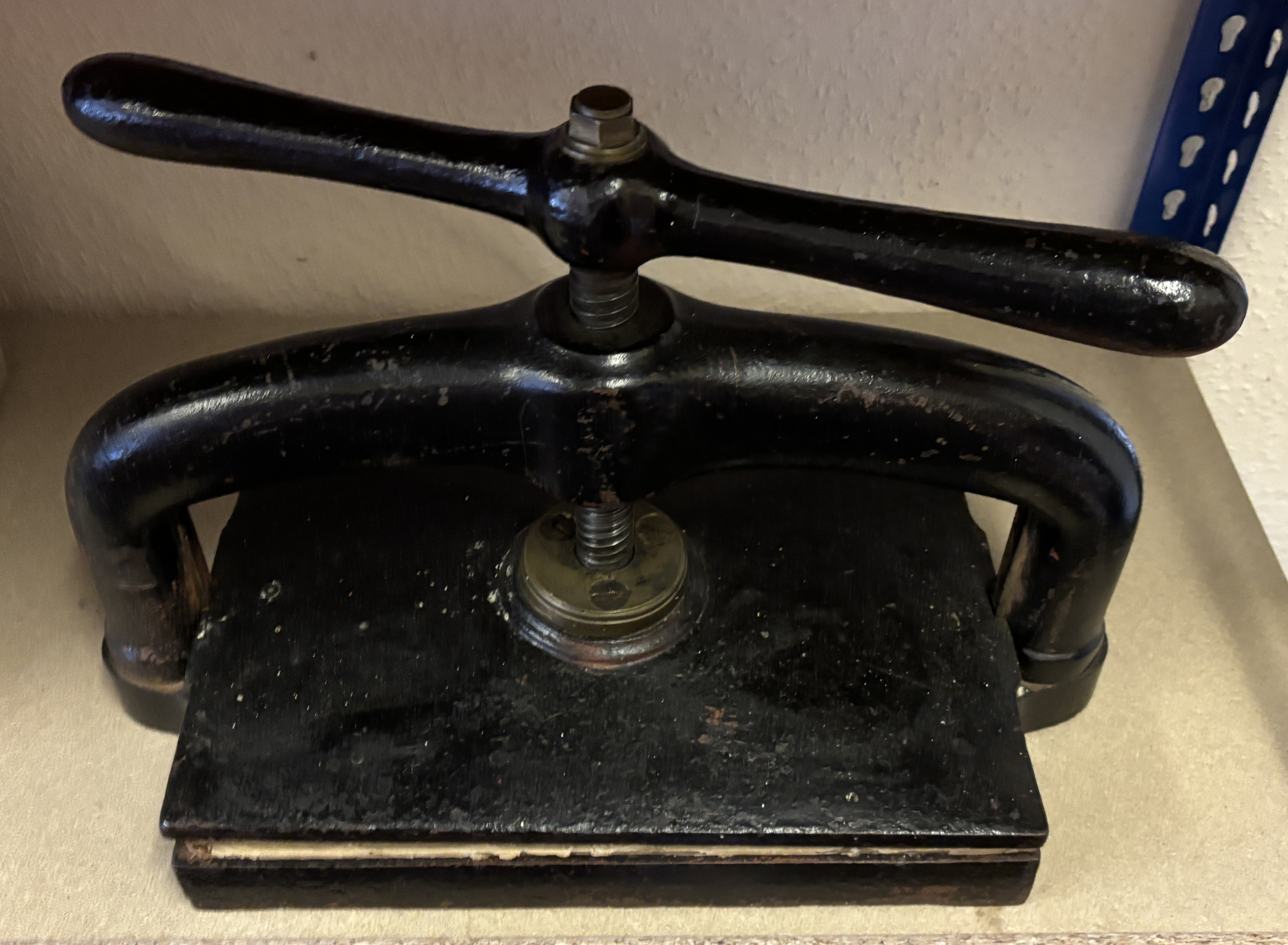 A Victorian black painted cast iron book press, the plate 38 x 25.5cm